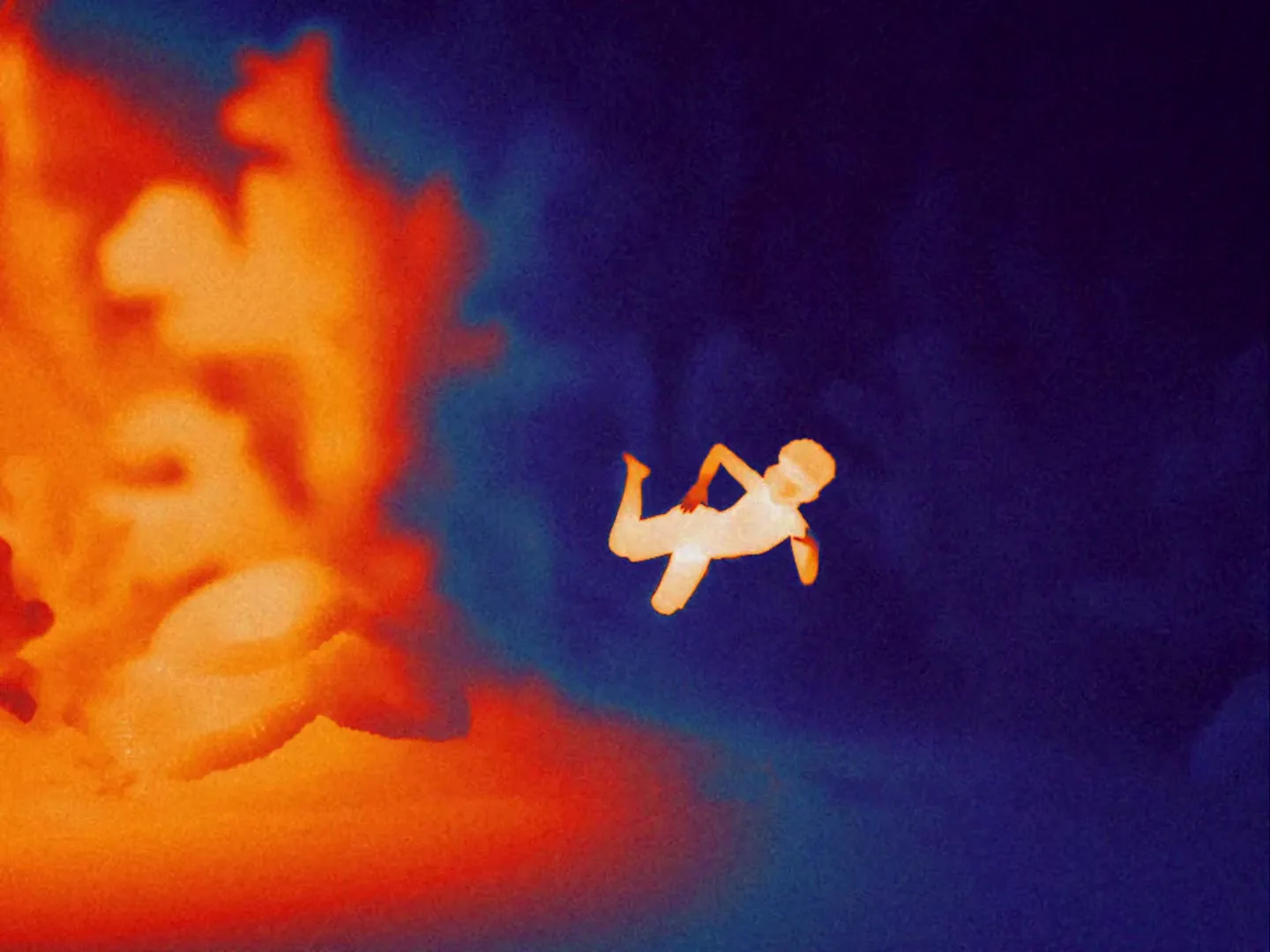 A thermal image of a baby floats in dark blue water, with a large orange heat signature on the left, suggesting danger.