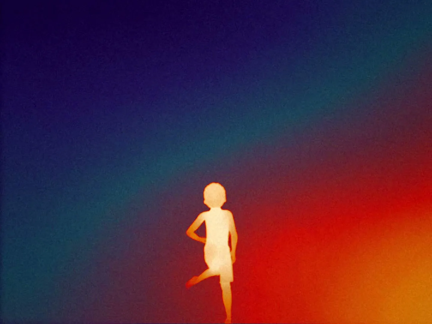 A silhouetted child dances against a vibrant, grainy background that transitions from blue to red.