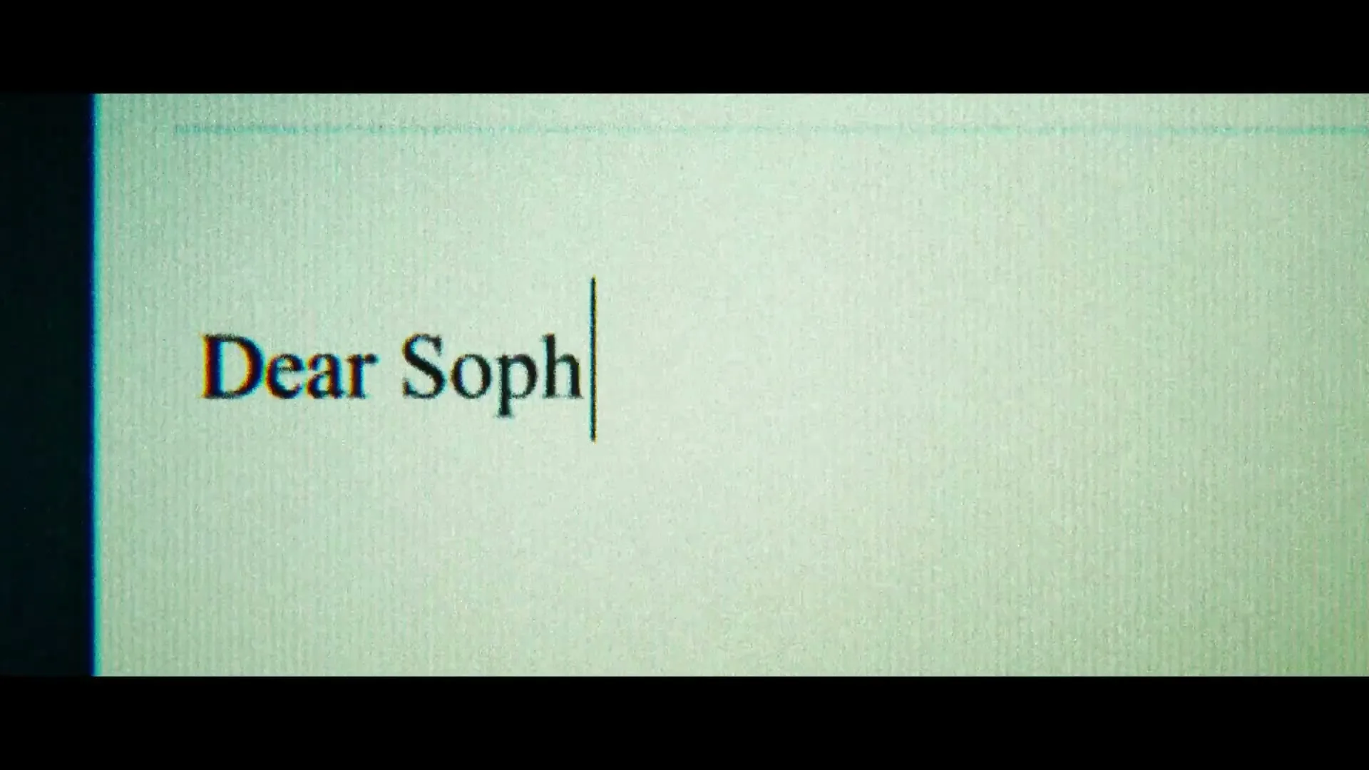 The words "Dear Sophie," are typed out on a computer screen, with a blinking cursor following the text.