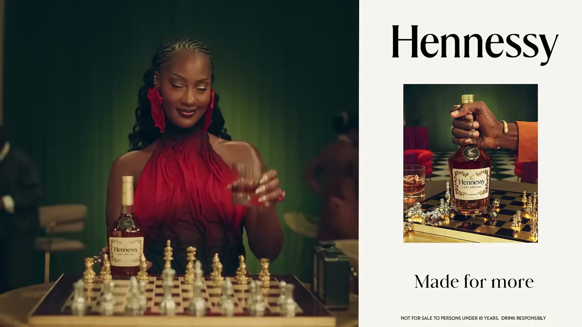 A woman in a red dress with large red earrings smiles while holding a glass of Hennessy over a chessboard in a dimly lit room.