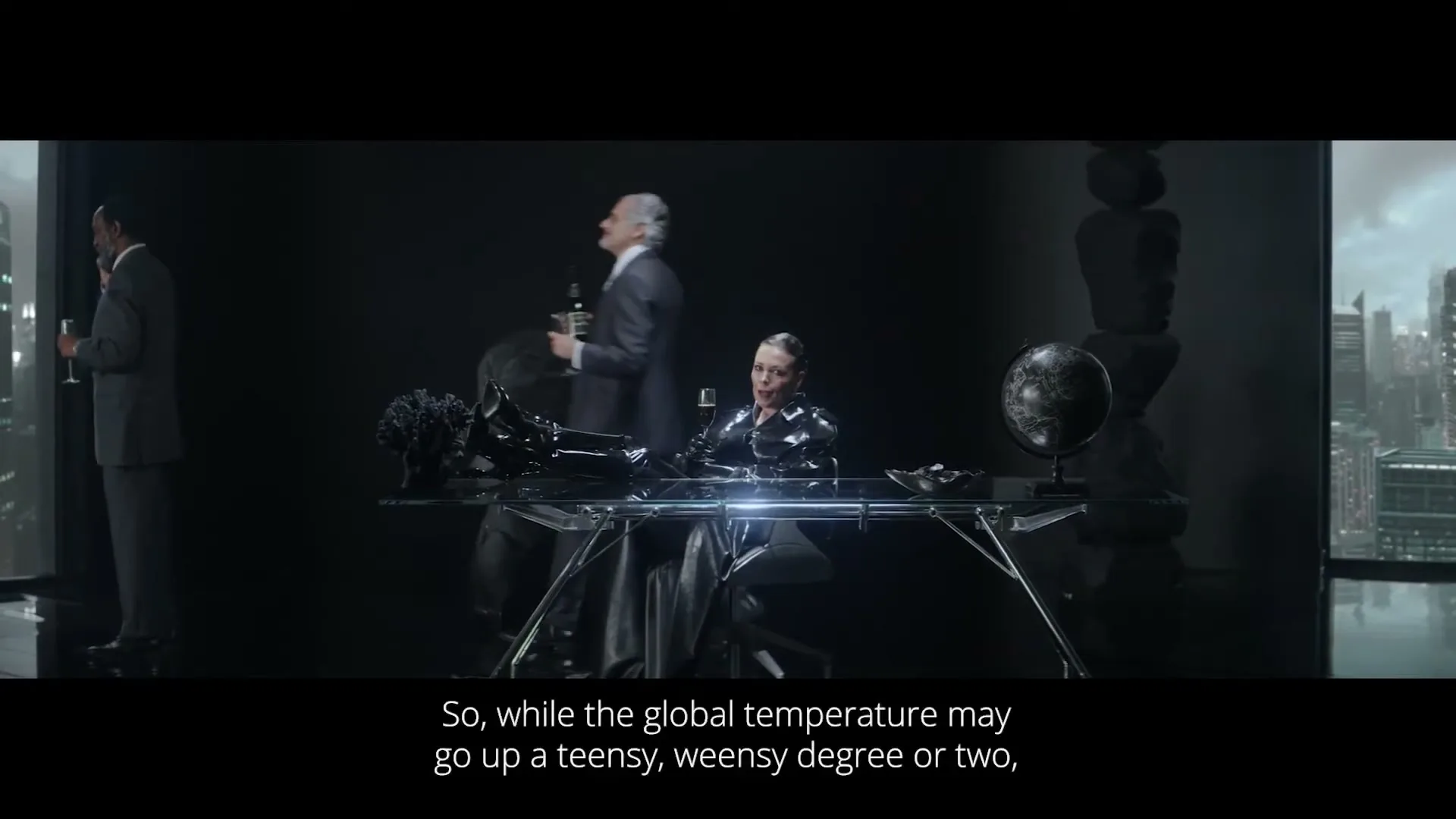 A woman in a black latex suit sits at a desk, while two men in suits stand nearby, one offering her a drink, in a dark, futuristic office.