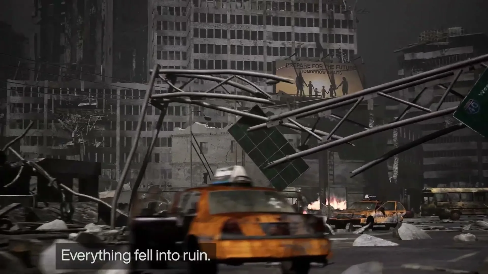 A wide shot of a destroyed city with rubble, abandoned cars, and crumbling buildings under a dark sky, with a billboard in the background.