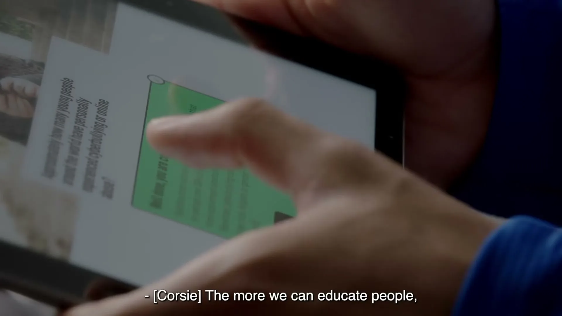 A person's hands hold a tablet, interacting with a quiz about cyberbullying, with a green correct answer highlighted on screen.
