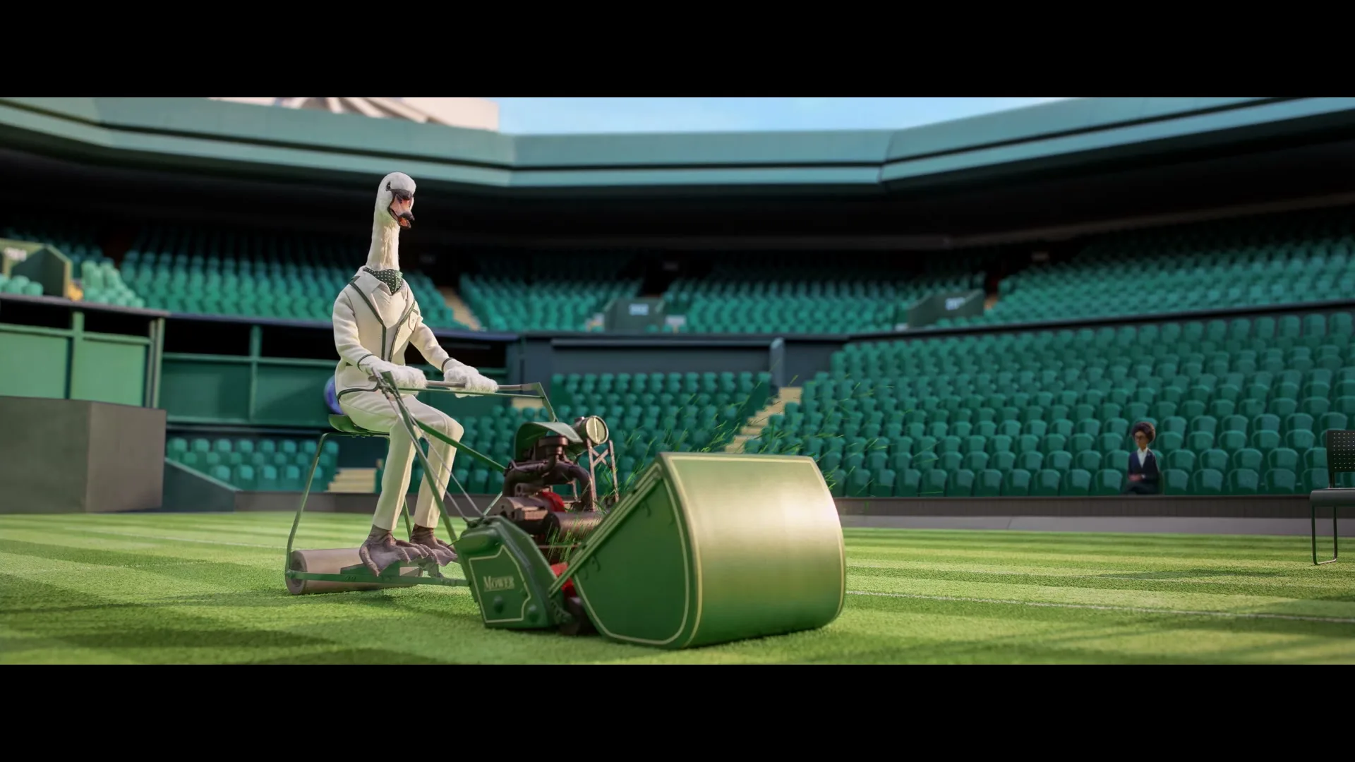 A swan in a white suit rides a lawnmower on a tennis court, with empty green stadium seats in the background.