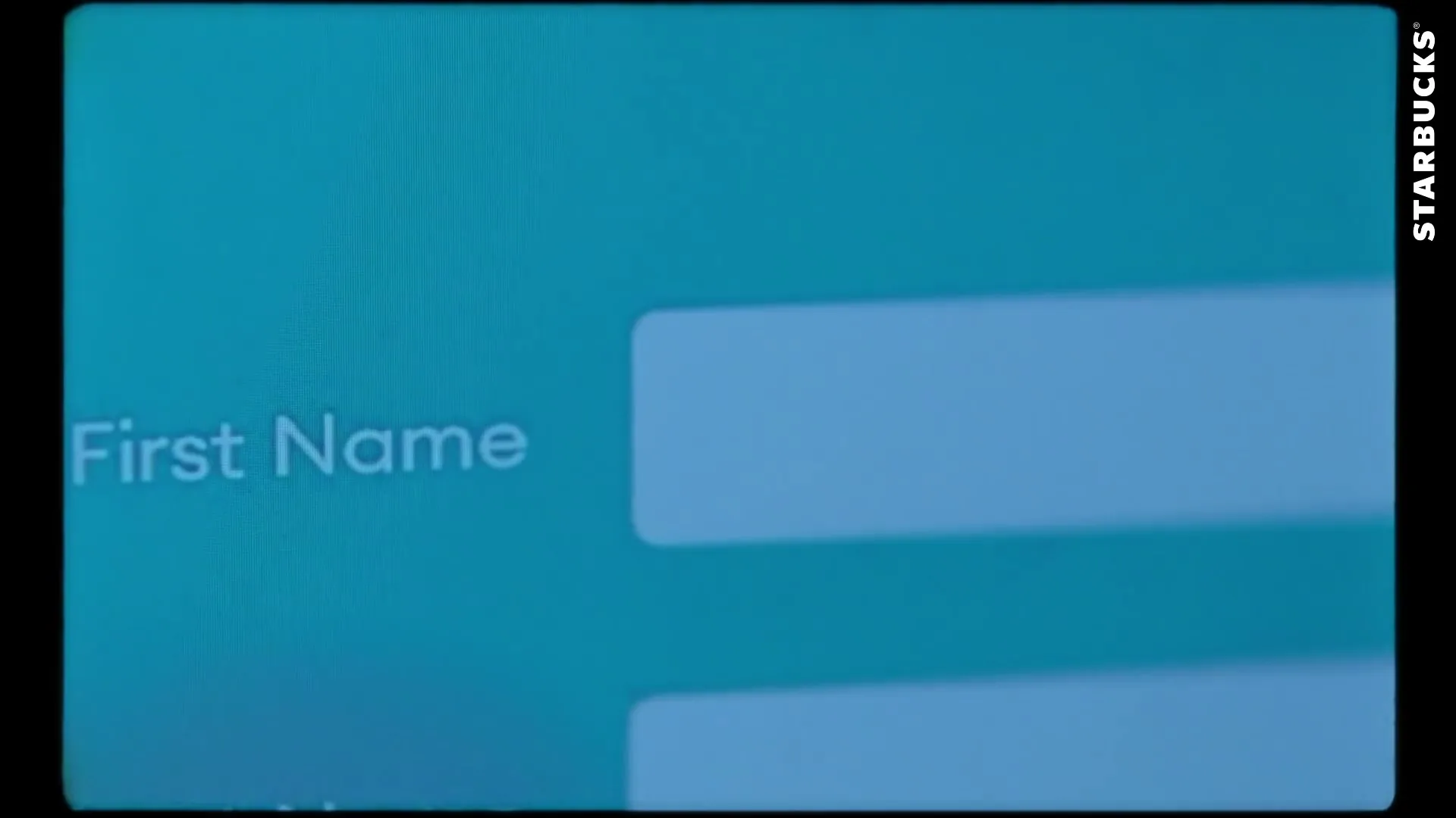 A close-up shot of a digital screen showing a "First Name" input field with a blinking cursor, suggesting user interaction.