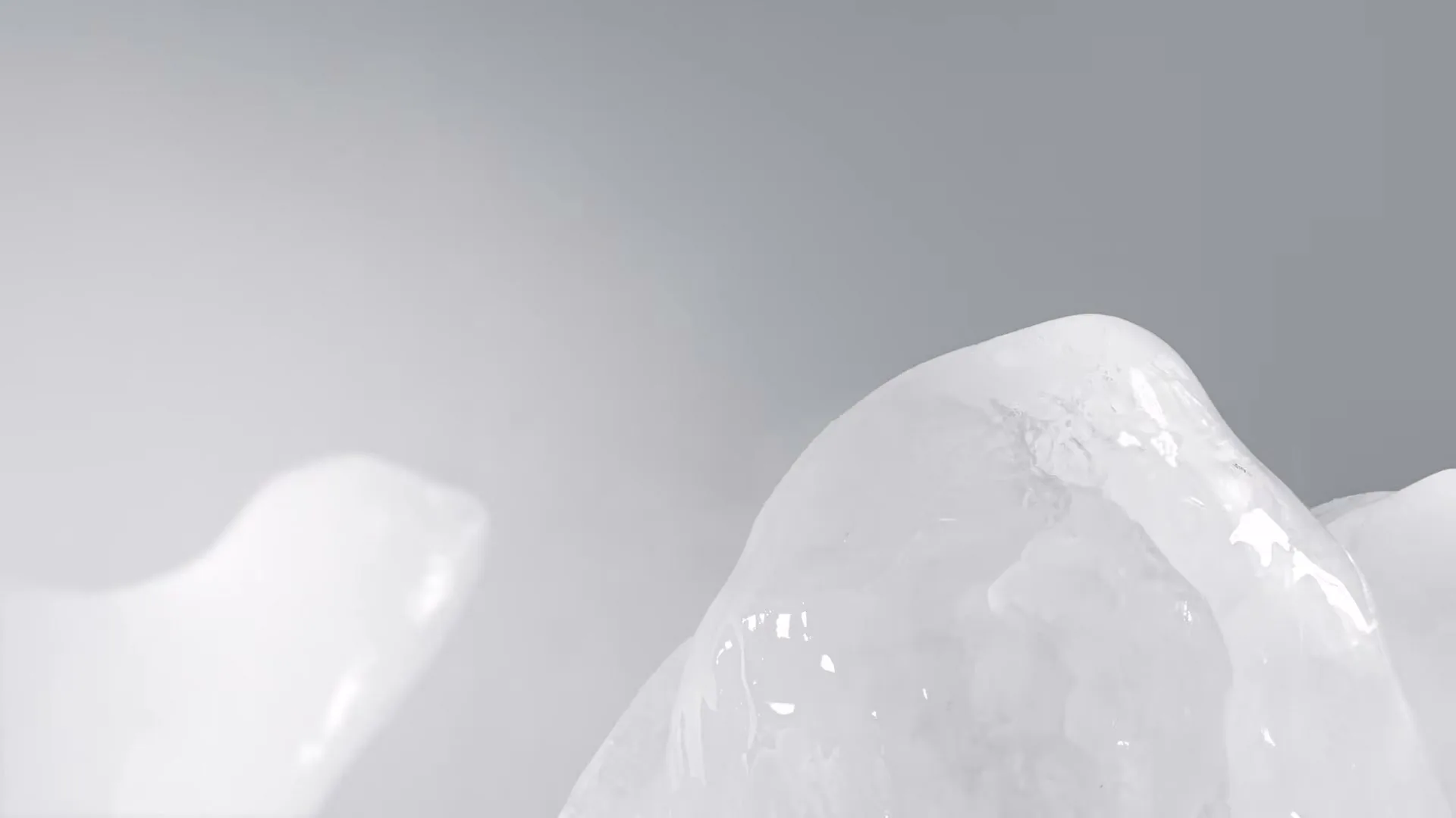 A close-up shot shows ice cubes melting and dripping water, with a soft, bright background, as a voiceover discusses melting rates.