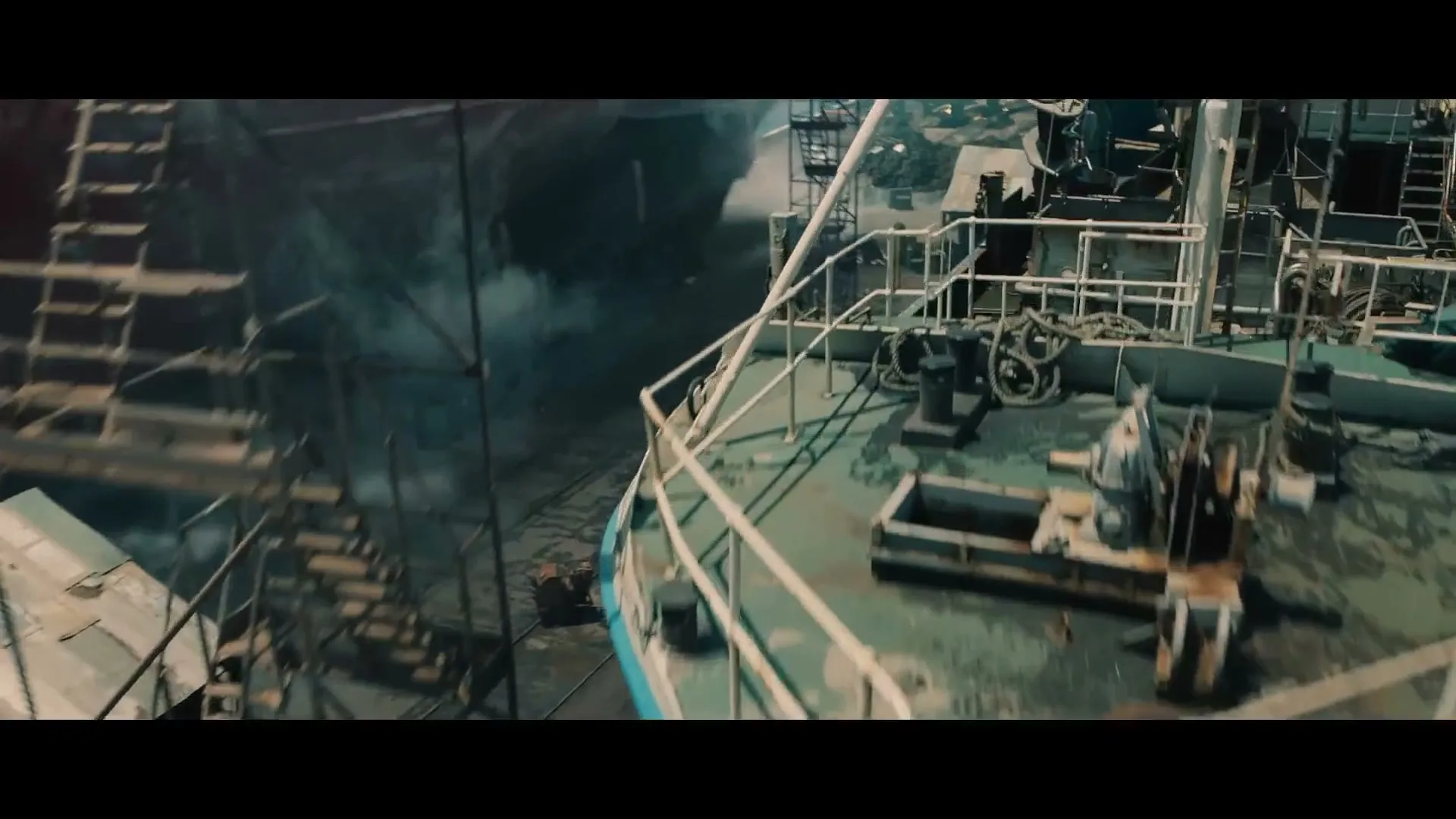 A dark BMW SUV drives through a bustling shipyard, passing by large ships and industrial structures, with workers in the foreground.