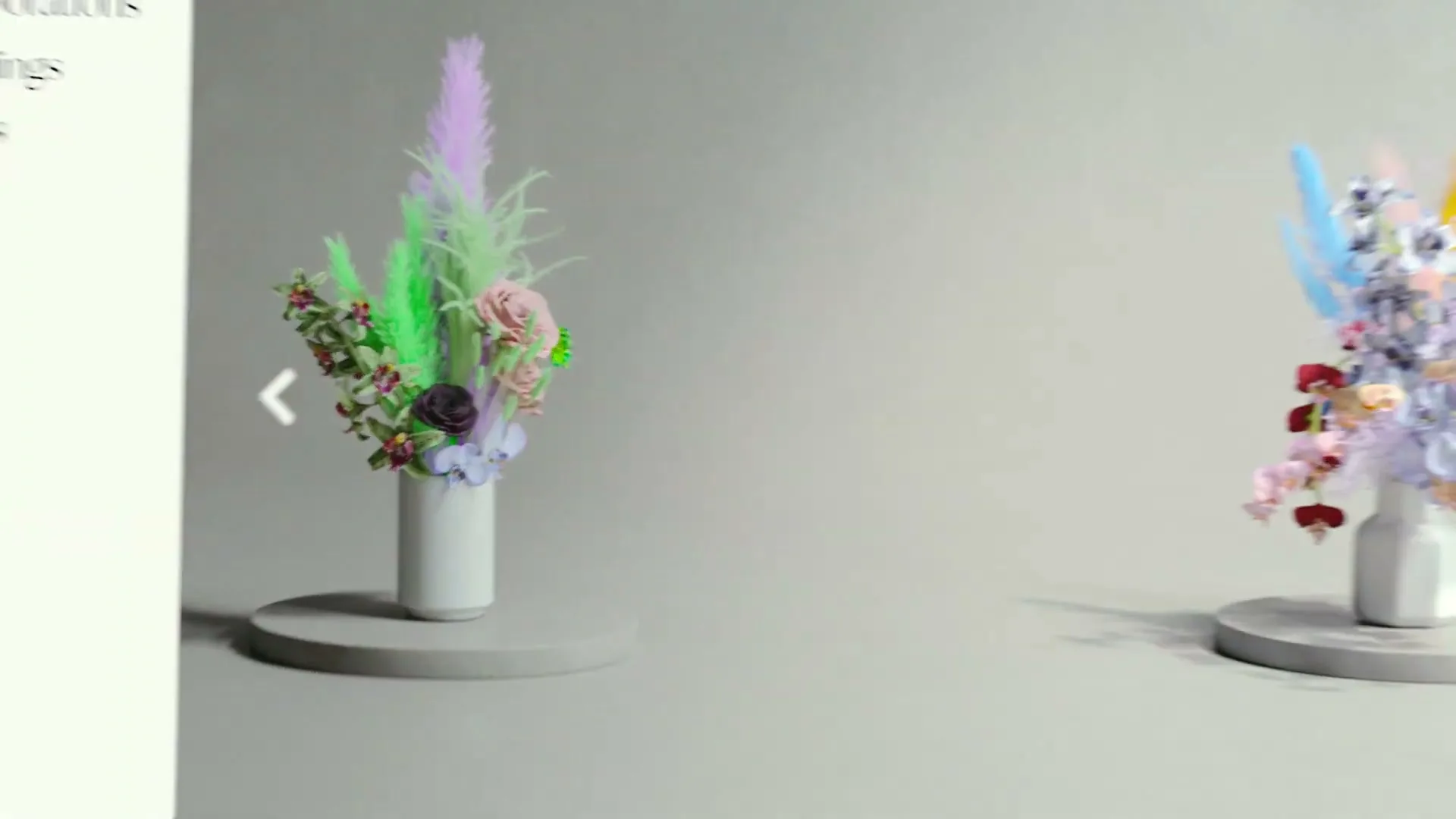 A digital flower arrangement in a white vase on a gray pedestal transforms into a colorful bouquet, then a person scrolls through a tablet displaying the same image.