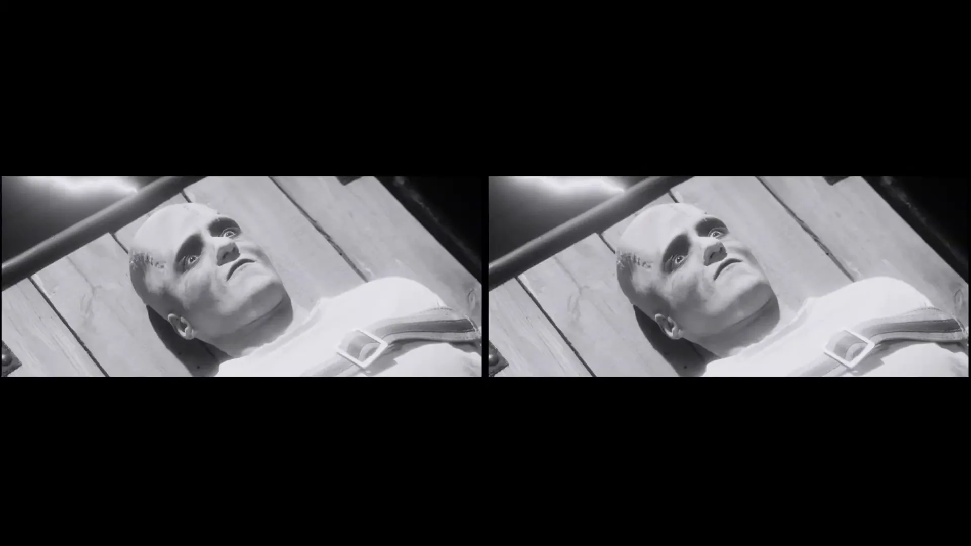A black and white archival footage shot shows a hand pressing a button, then cuts to Frankenstein's monster lying on a wooden table, looking up.
