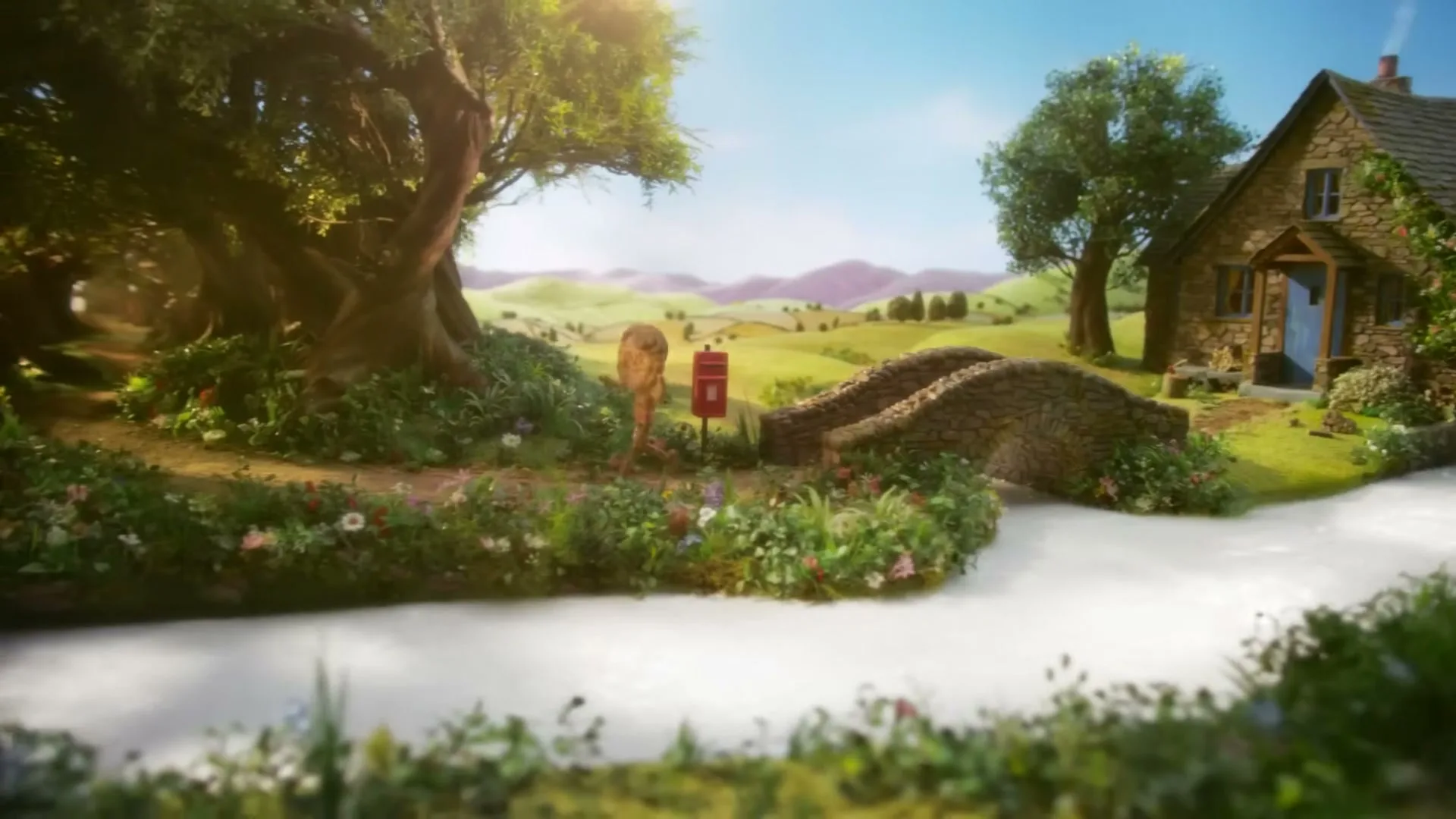 A small biscuit boy walks along a path next to a stream, passing a stone bridge and a cottage in a whimsical, animated landscape.