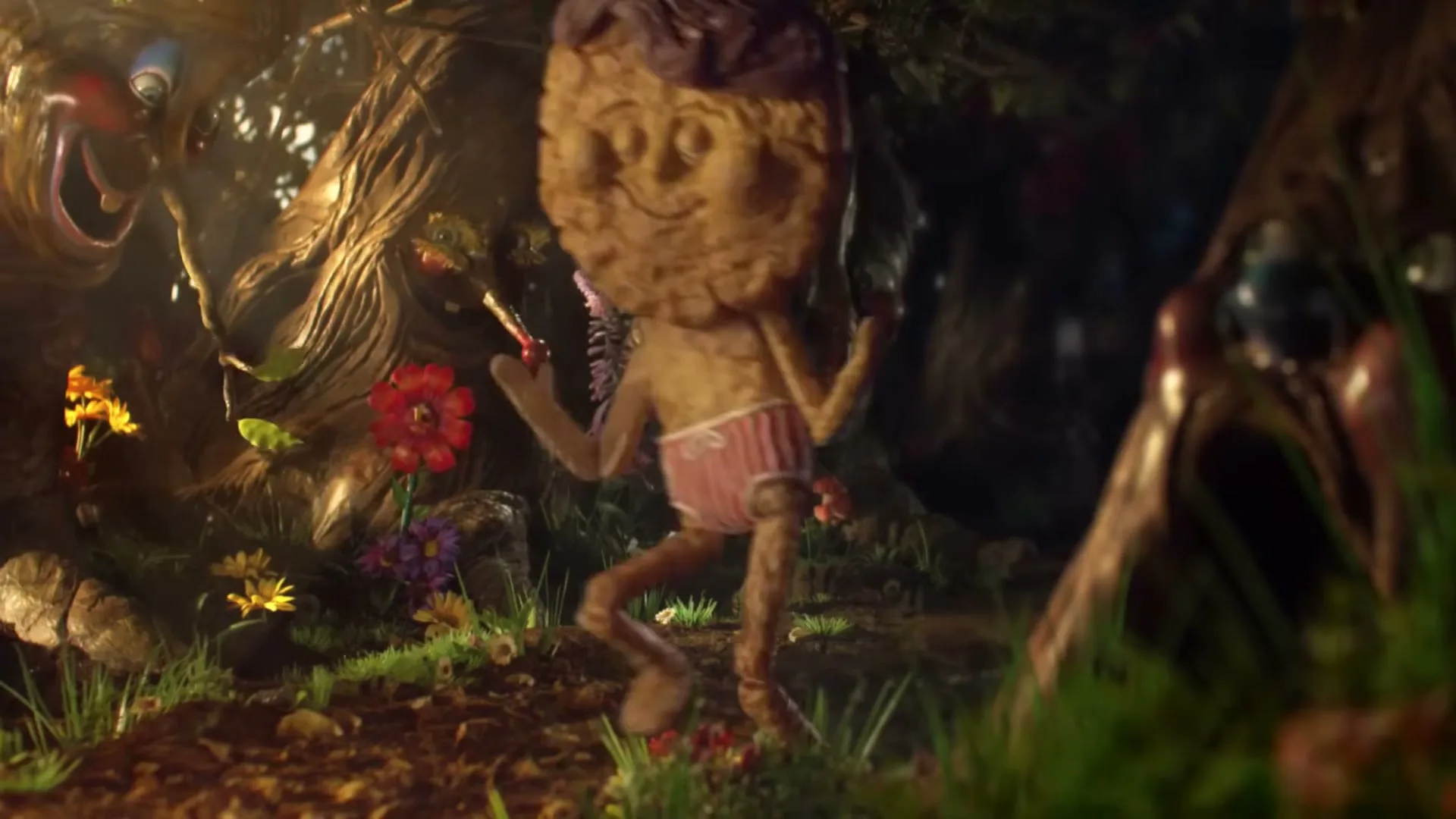A small, animated biscuit boy in pink underwear dances in a magical forest with trees that have faces, as he is being chased by a monster.