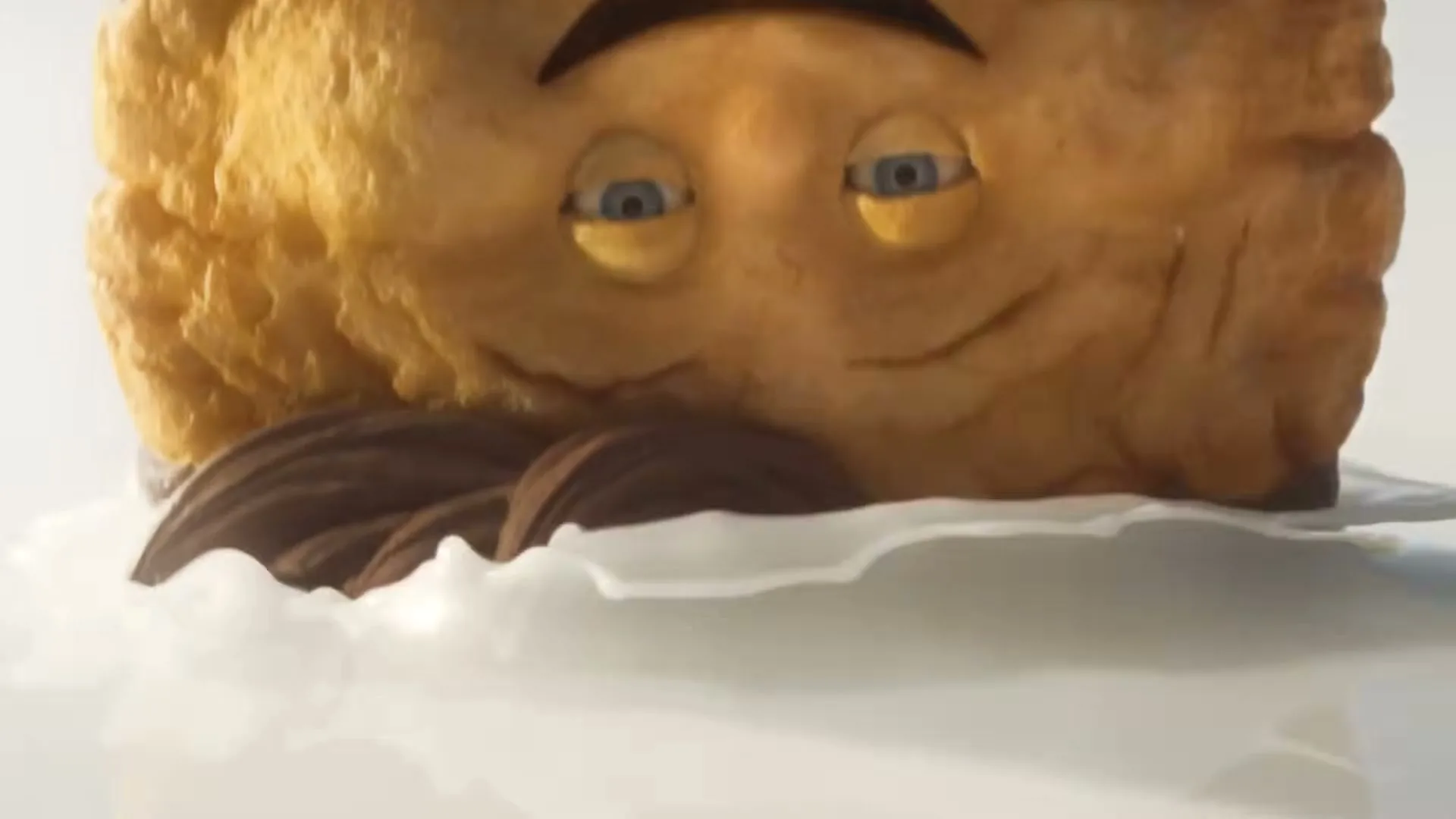 A biscuit character with a mustache is submerged in milk, then slowly sinks, with only its eyes visible above the surface.