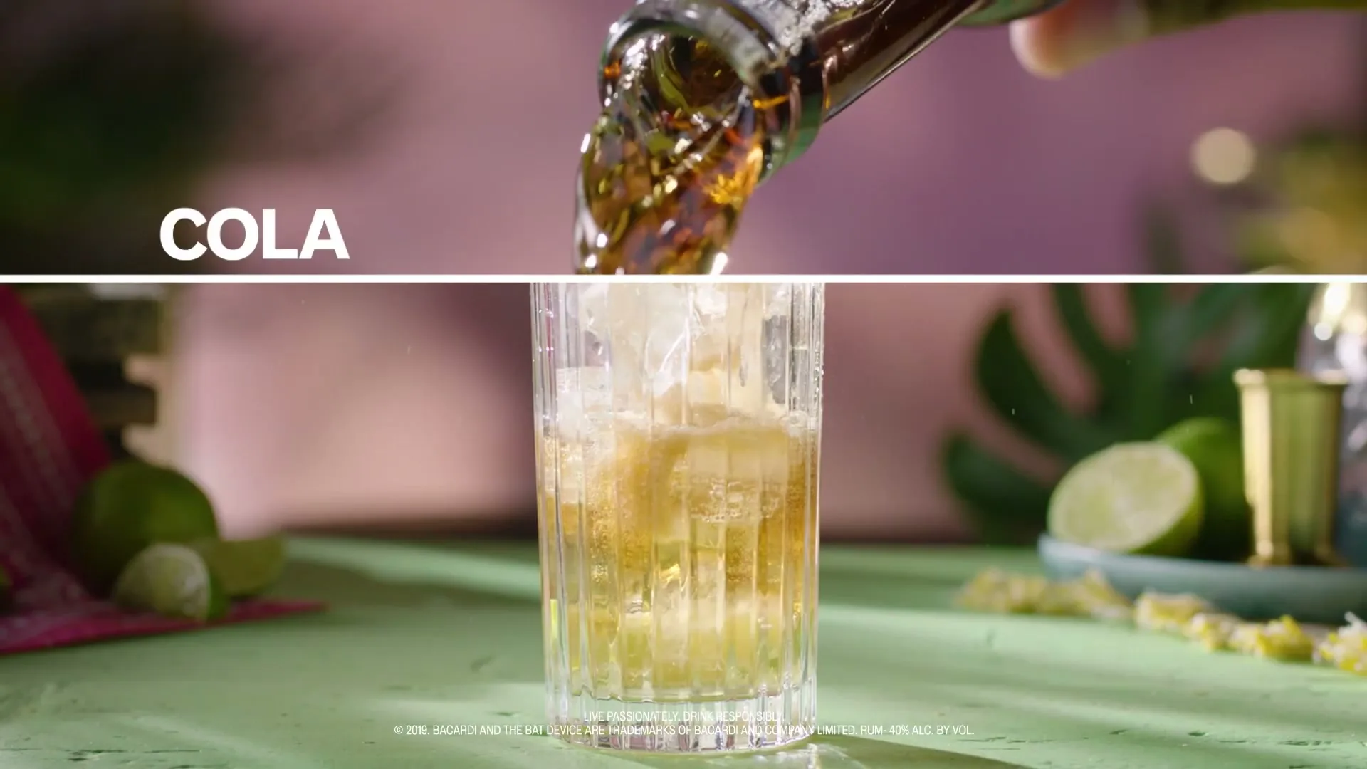 A close-up shot shows cola being poured from a bottle into a glass filled with ice, surrounded by limes on a green surface.