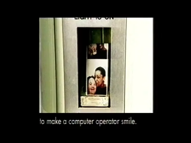 A close-up shot shows a light switch with a small screen displaying various faces, as text appears below it.
