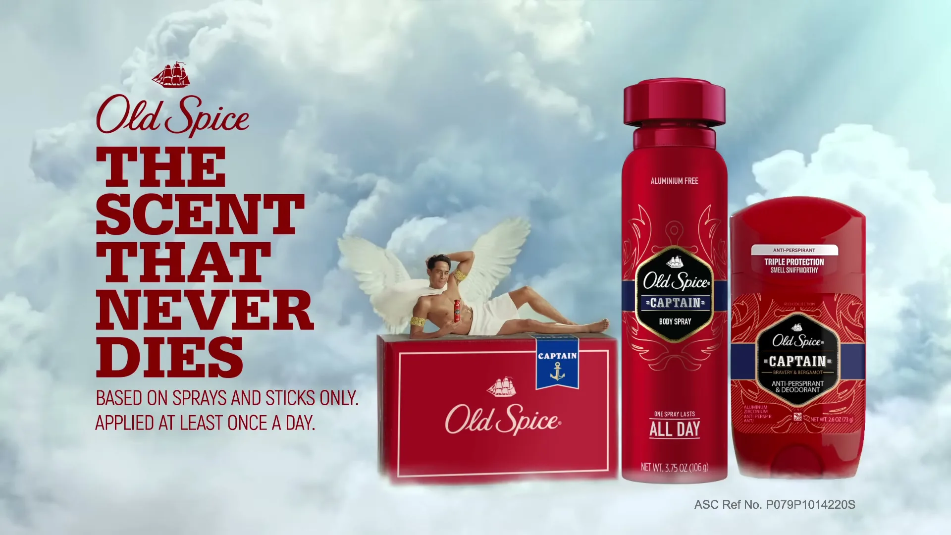 A man with white wings and a white towel reclines on a red Old Spice box, next to a red Old Spice body spray and deodorant, all against a cloudy sky.