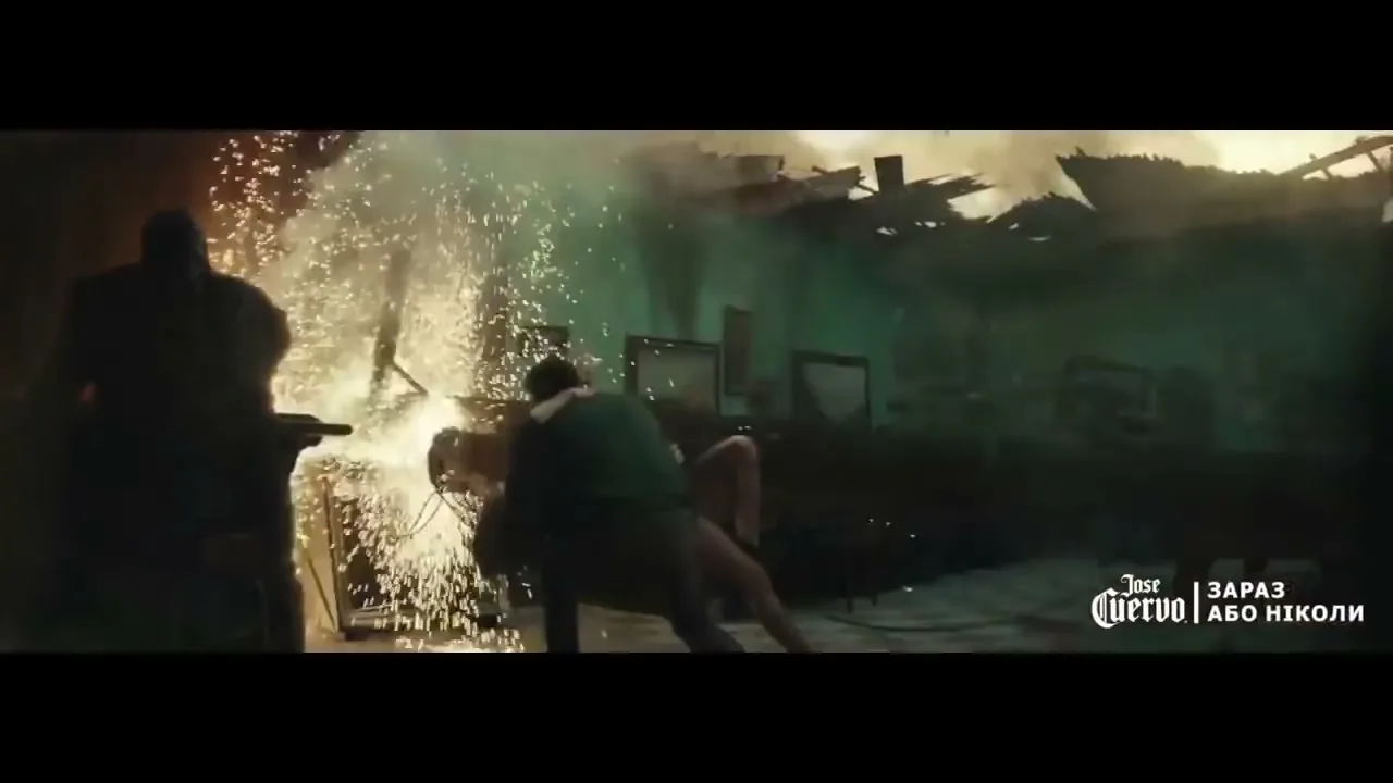 A group of people are in a dilapidated room, with sparks flying from a welding torch, as they try to salvage items before the world ends.
