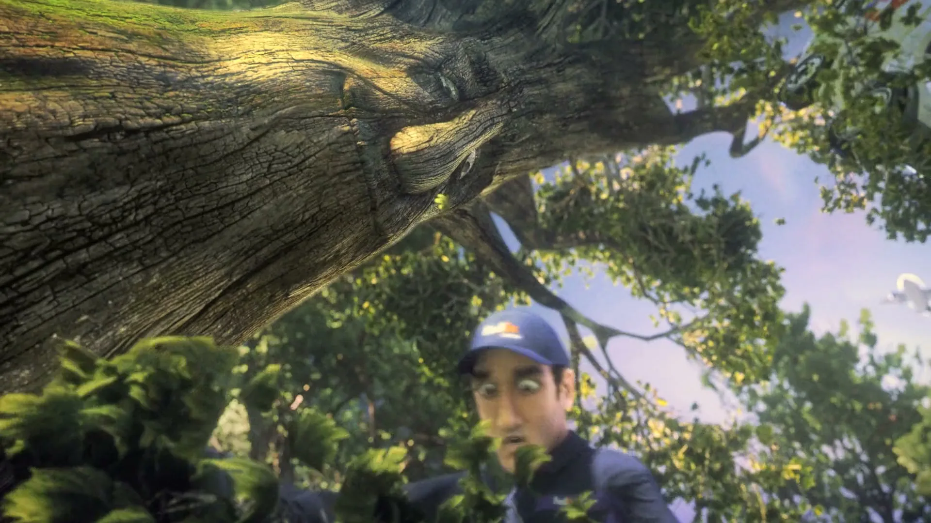 A FedEx delivery man in a purple uniform hangs from a tree branch, looking surprised, as a FedEx truck and plane are visible in the background of a magical forest.
