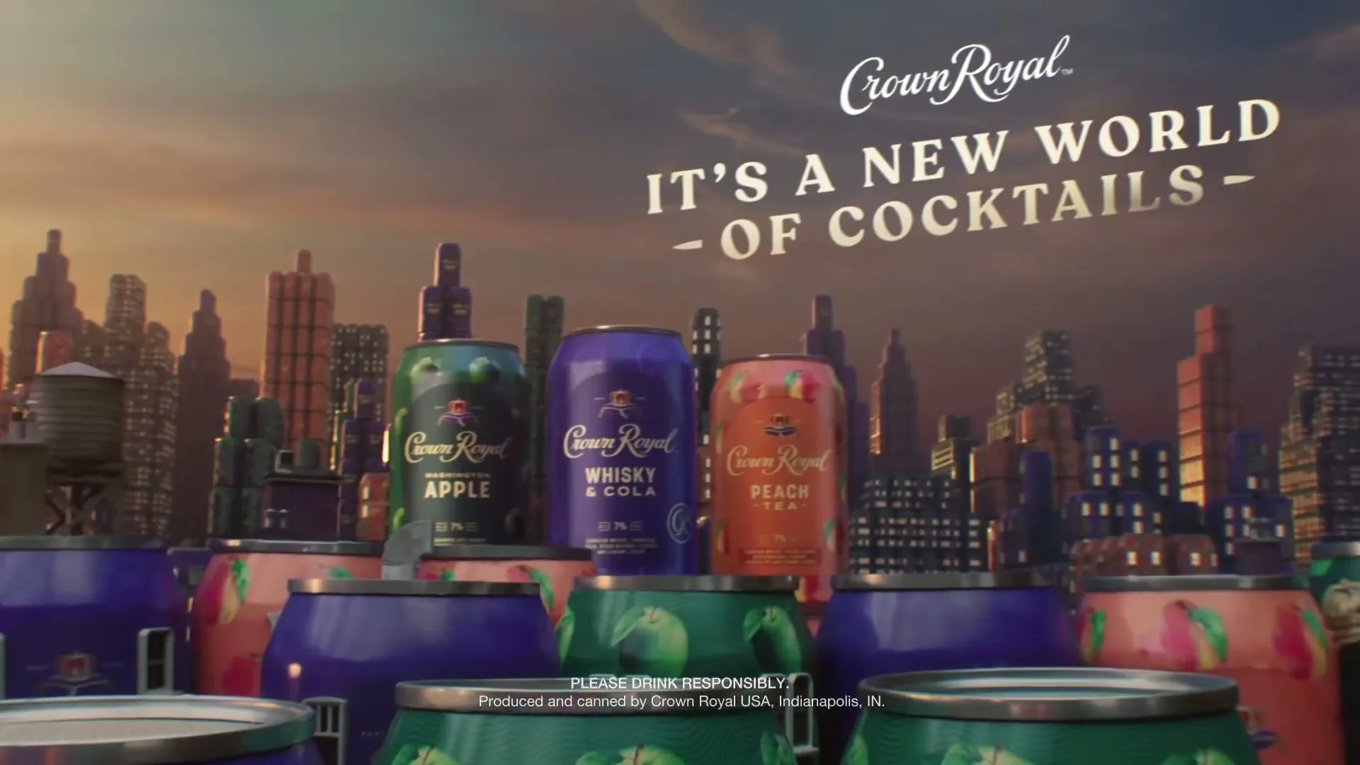 A wide shot of a cityscape made of Crown Royal cans, with three prominent cans in the foreground and text on screen.