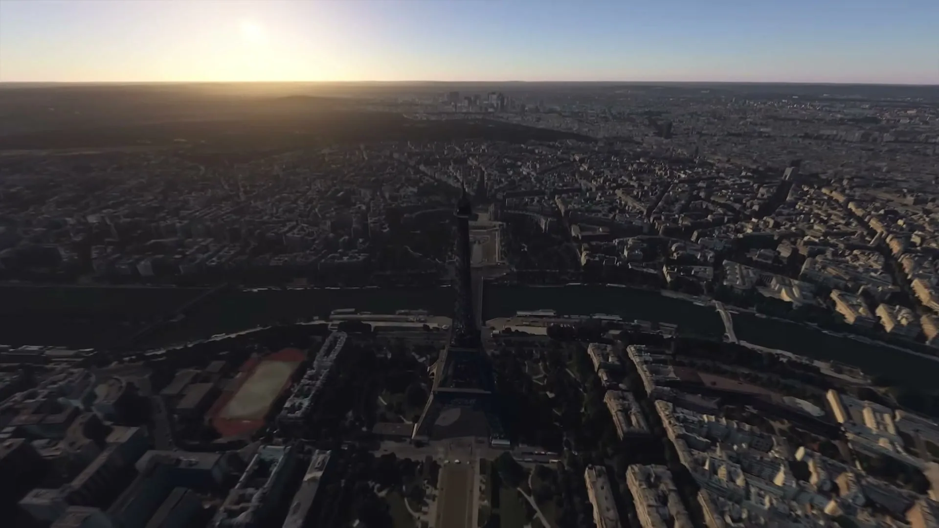 An aerial view of Paris, France, with the Eiffel Tower prominently featured, as the camera descends towards it during sunset.