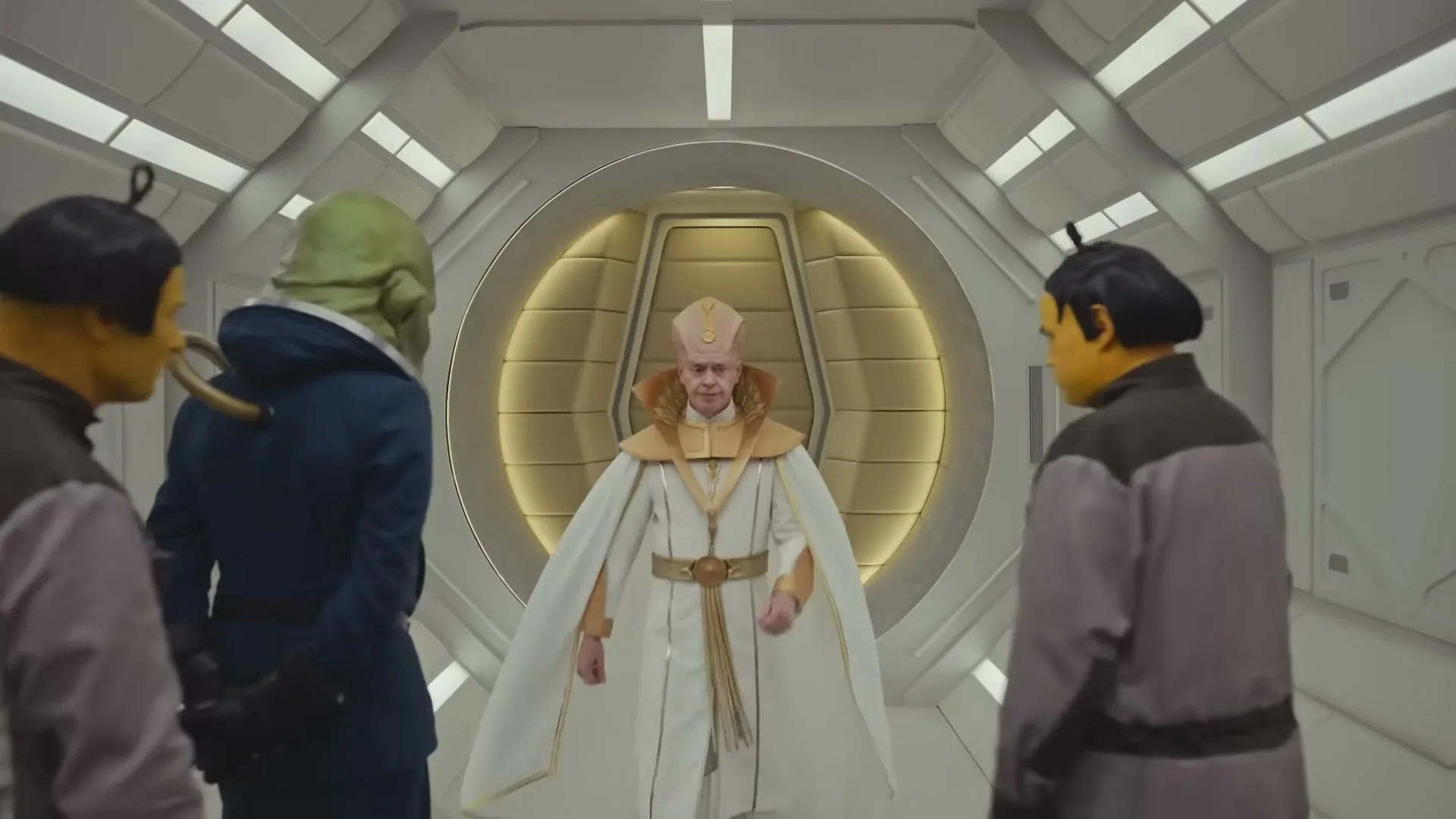 A man in a white and gold robe and miter walks through a circular doorway towards three alien-like figures in a futuristic hallway.