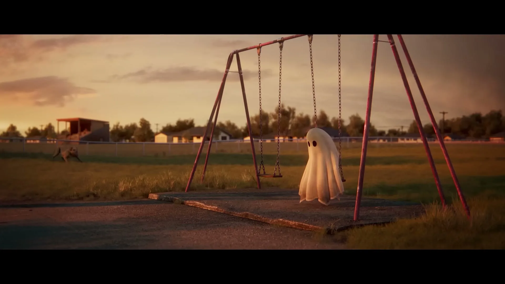 A small, white ghost-like figure sits alone on a swing set in a deserted park at sunset, with houses in the background.
