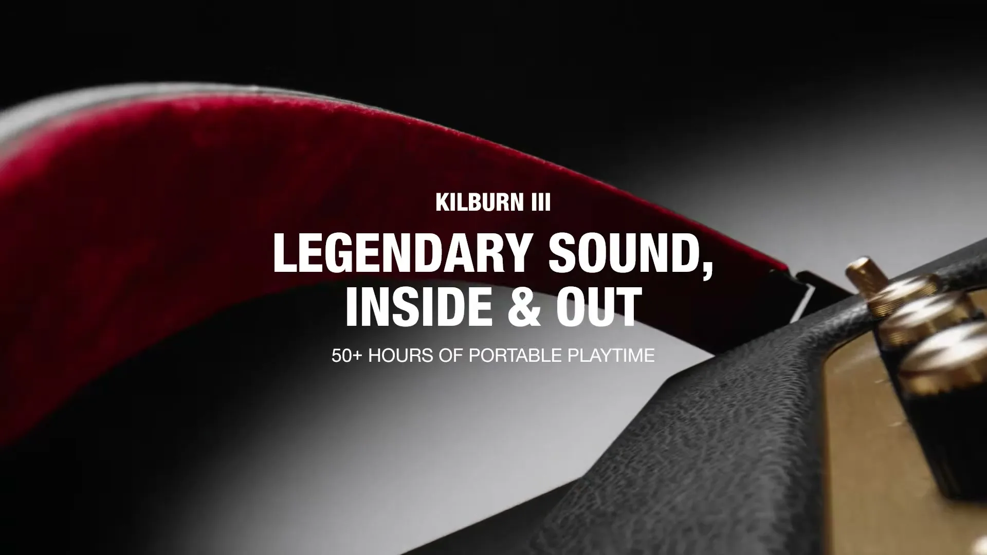 A close-up shot of a black and red Marshall speaker with gold accents, showcasing its design and features.