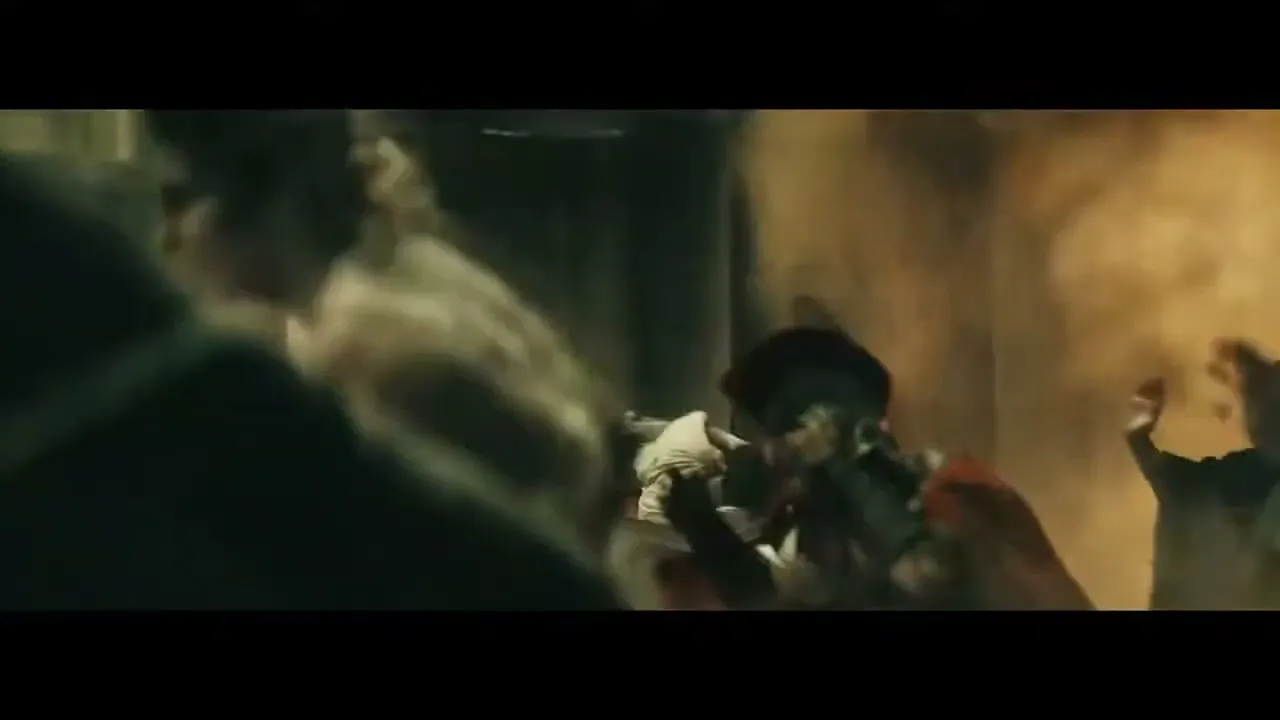 A man in ancient Roman attire is thrown to the ground amidst a chaotic, dusty scene of destruction, with debris flying around him.