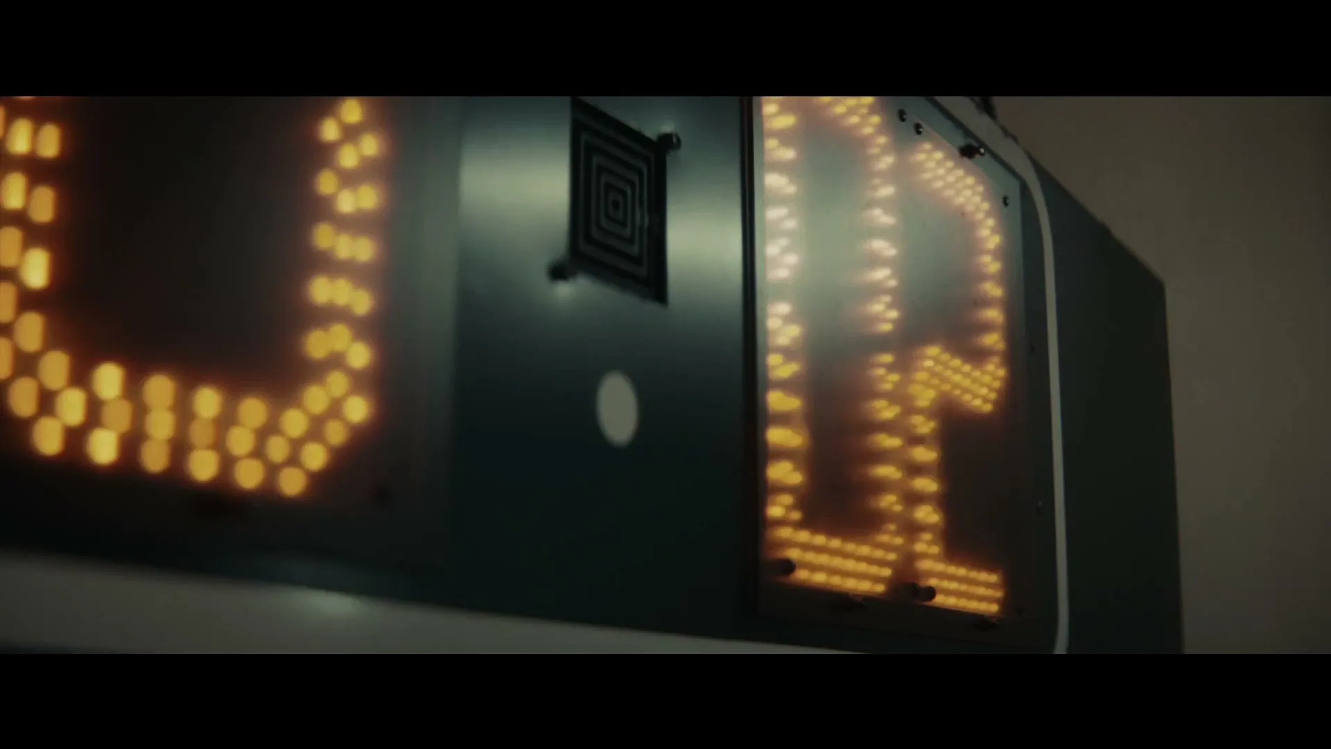 A close-up shot of a digital scoreboard displaying the number "16" in bright orange lights, suggesting a game or event is underway.