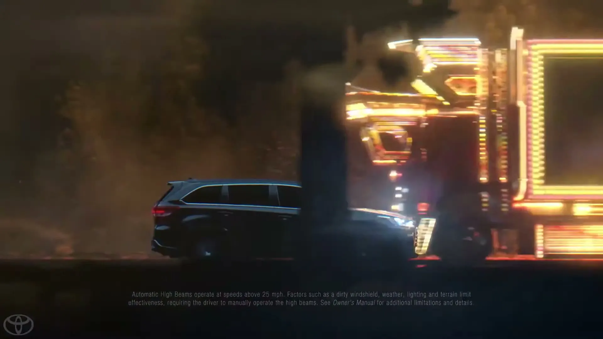 A dark blue Toyota Highlander SUV drives through a dark, wooded area at night, with bright, colorful lights appearing behind it.