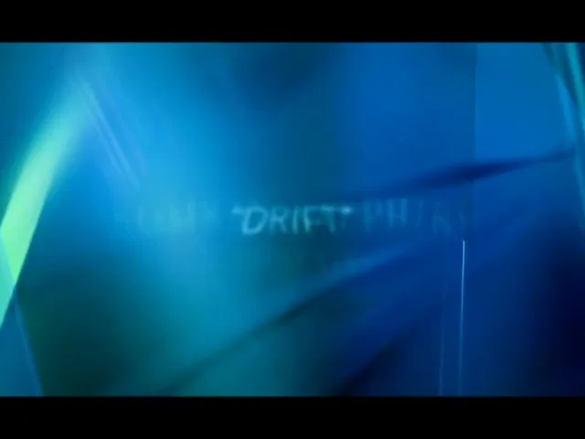 The words "BOMBAY SAPPHIRE PRESENTS" appear on a blue, abstract background, then fade to "DRIFT" as the background shifts.