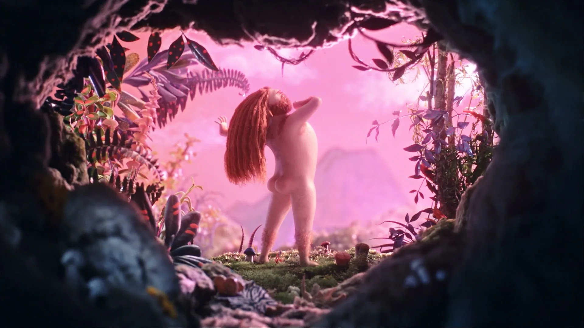 A hairy, naked, human-like creature with long red hair stands in a lush, pink-hued cave opening, looking out at a vibrant, alien landscape.