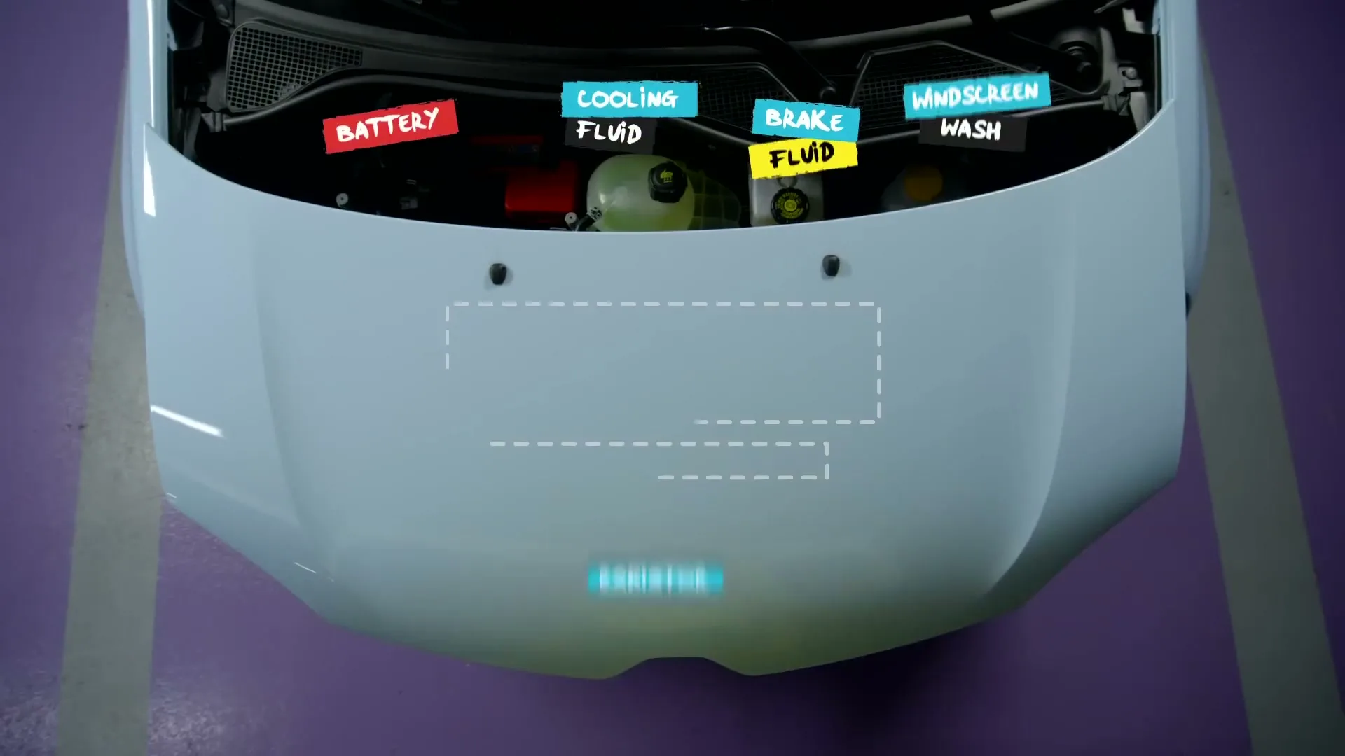 A person in a yellow shirt opens the hood of a white car, revealing the engine with animated labels for car parts in a parking garage.