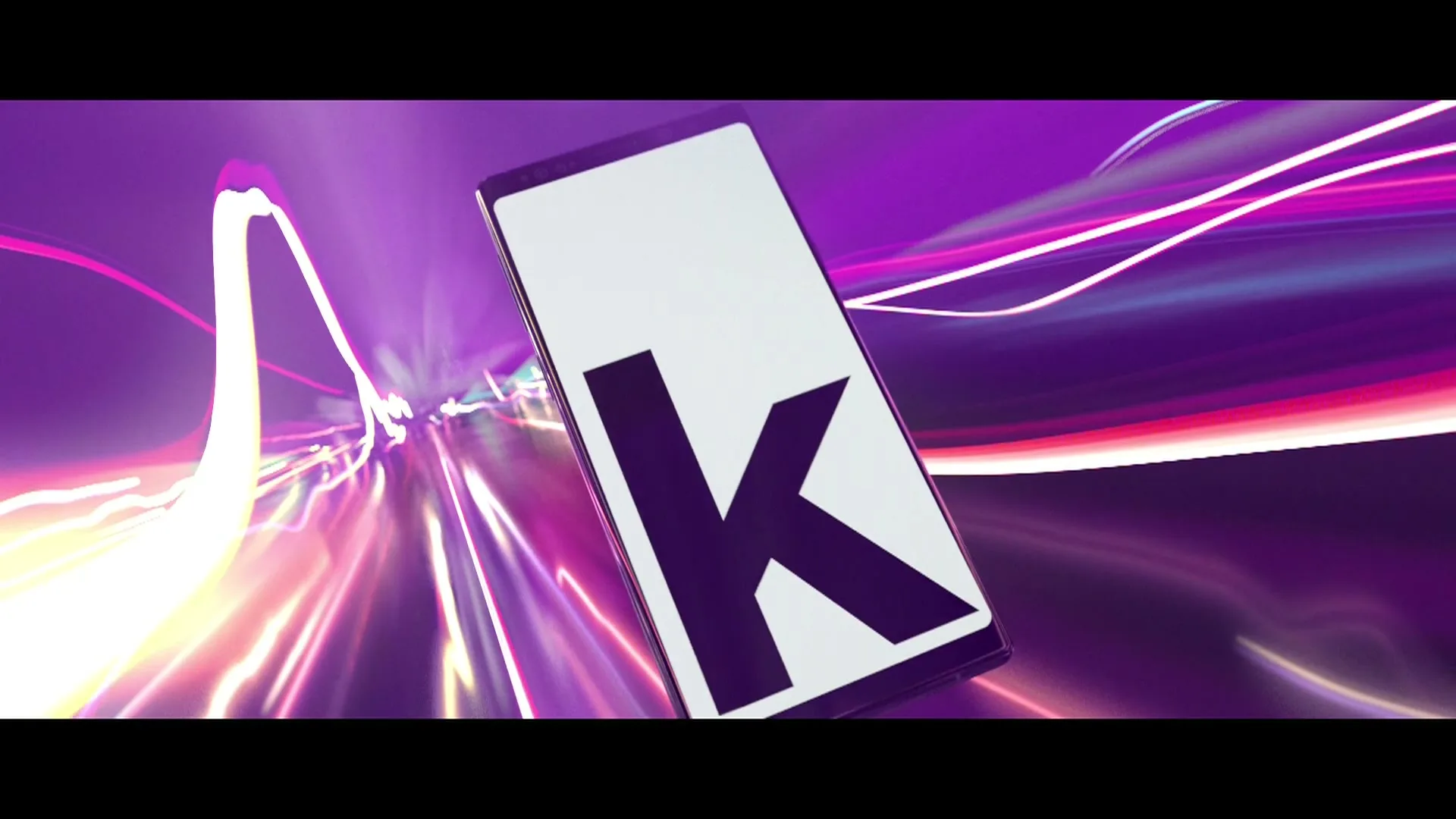 A smartphone with a white screen displaying text and a letter, rotates and disappears into a tunnel of purple and pink light trails.