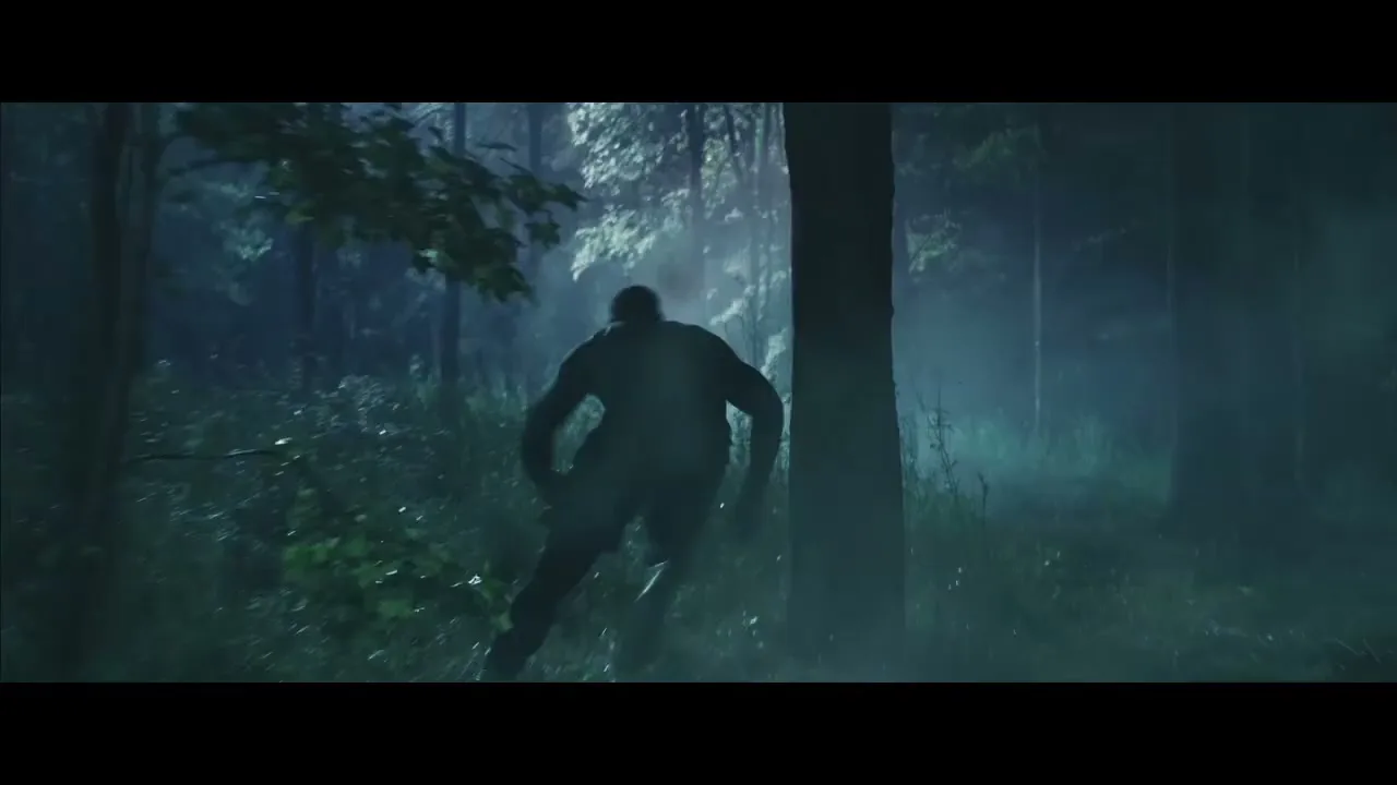 A male athlete in dark athletic wear runs through a dark, misty forest at night, dodging obstacles and moving quickly.
