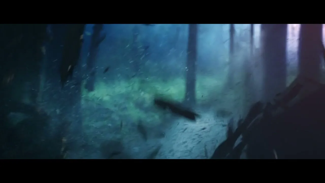A male athlete in dark athletic wear runs through a misty, dark forest at night, with light shining through the trees.