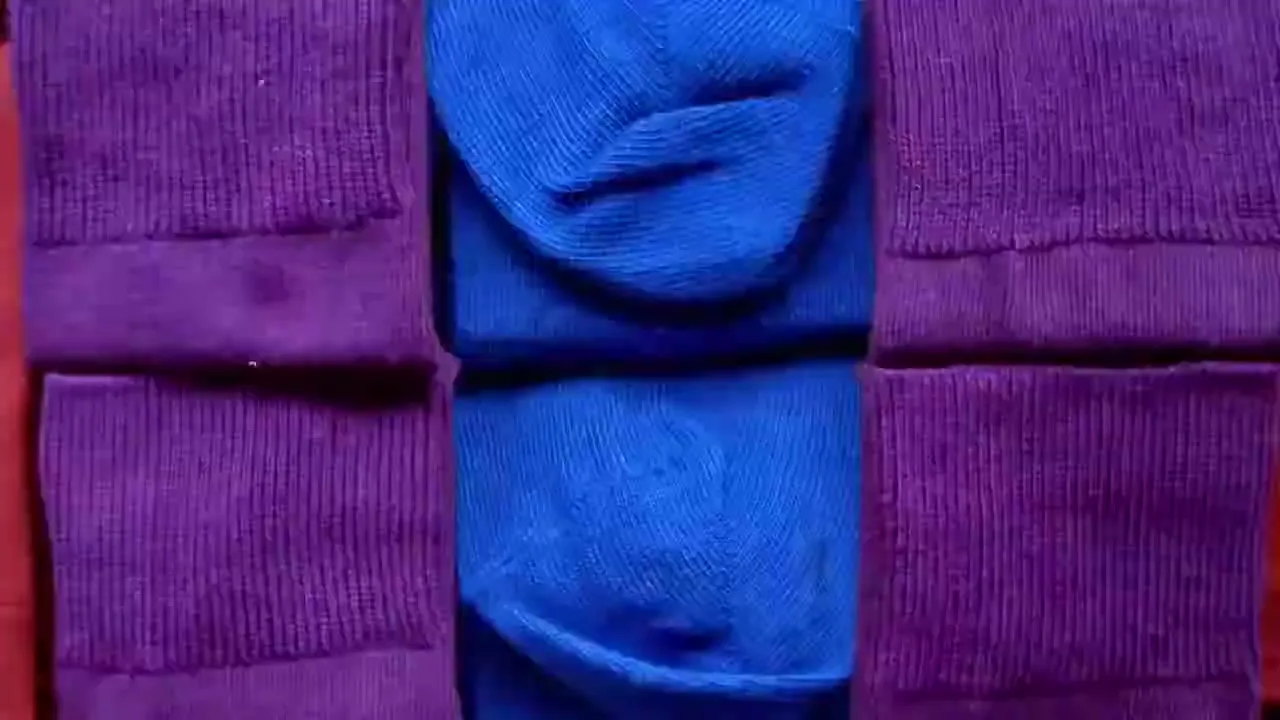 A top-down view shows a grid of folded red fabric transforming into purple, then blue, then teal fabric.