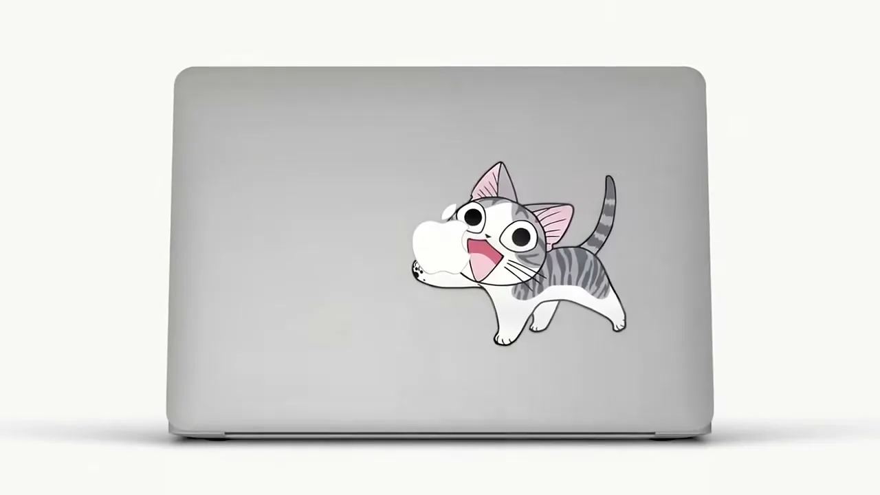 A cartoon cat sticker on a silver laptop is replaced by a cartoon squirrel sticker on the same laptop, on a white background.