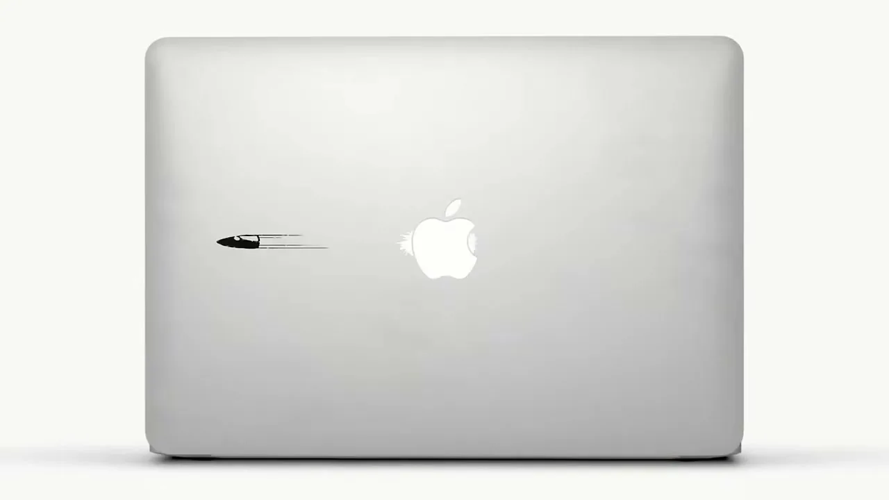 A series of animated stickers are applied to the back of a silver laptop, transforming the Apple logo into different cartoon scenarios on a white background.