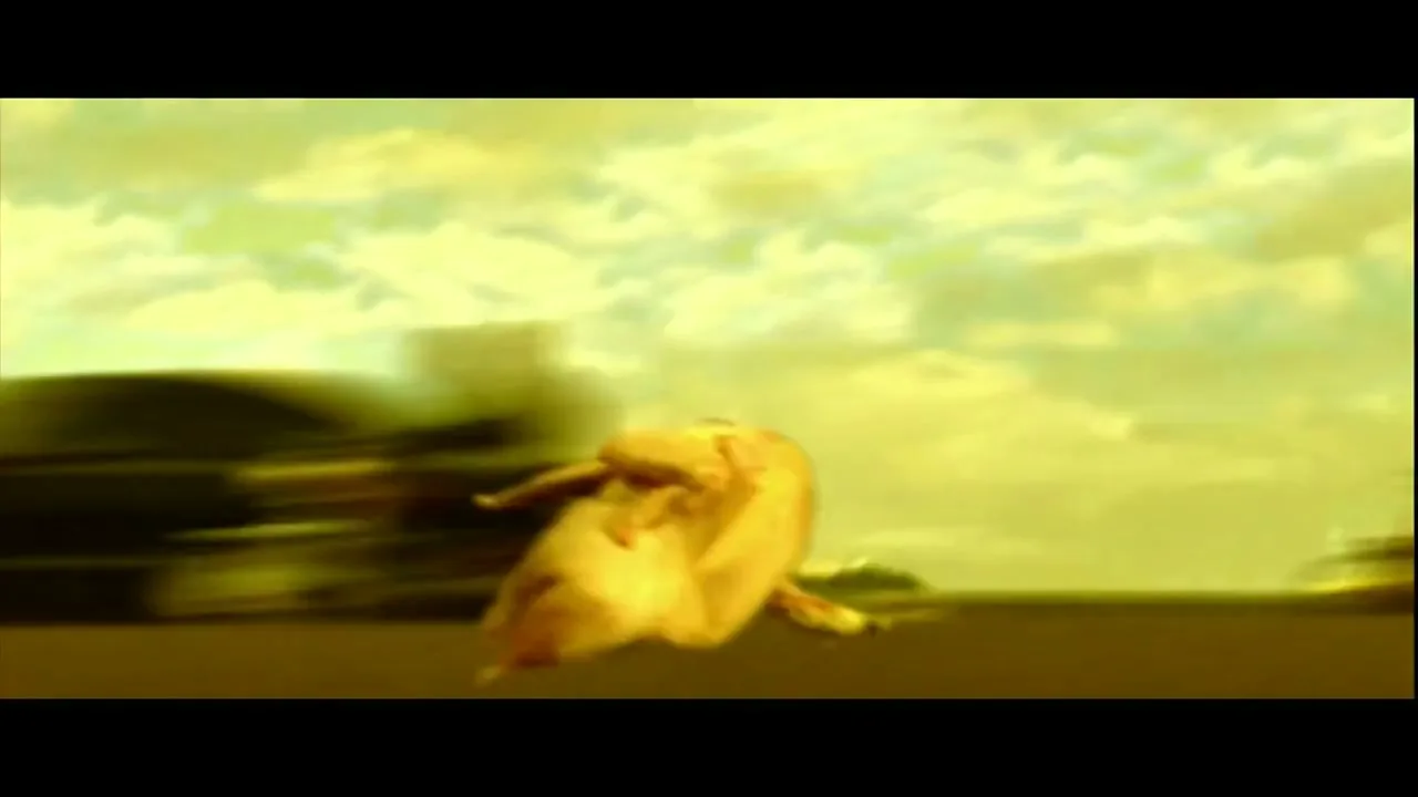 A chicken with a long neck and a yellow head runs across a road with blurred cars in the background under a yellow sky.
