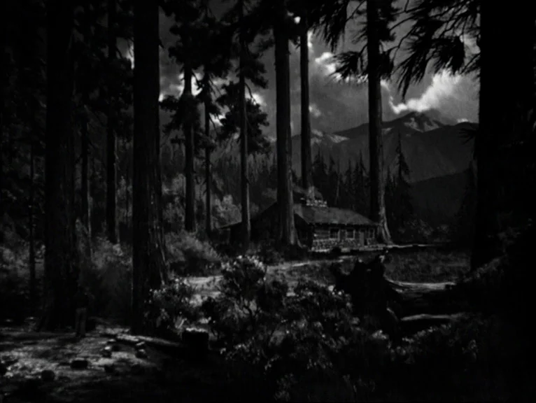 chiaroscuro lighting example from Saboteur: A dark, dense coniferous forest surrounds a solitary wooden cabin under a cloudy night sky. Distant mounta