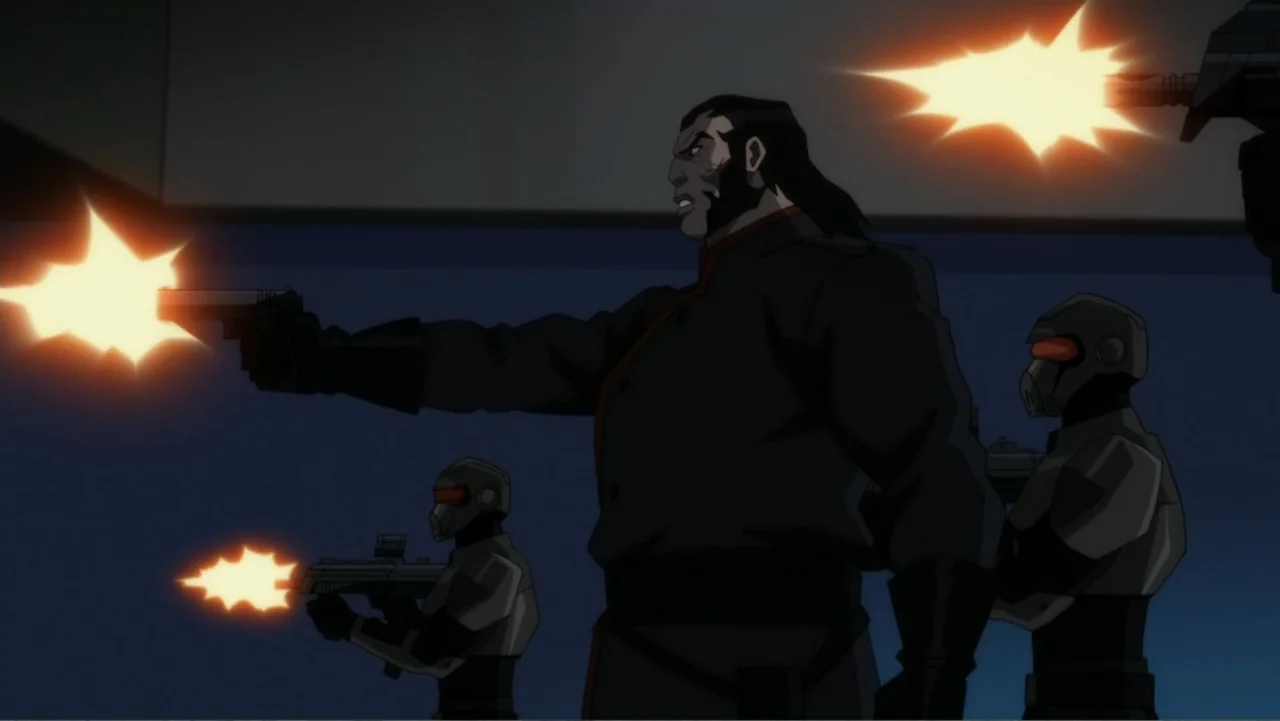 Suicide Squad: Hell to Pay (2018) movie still: medium — A dark, spartan industrial hallway provides the backdrop for a group of armed figures. A man…