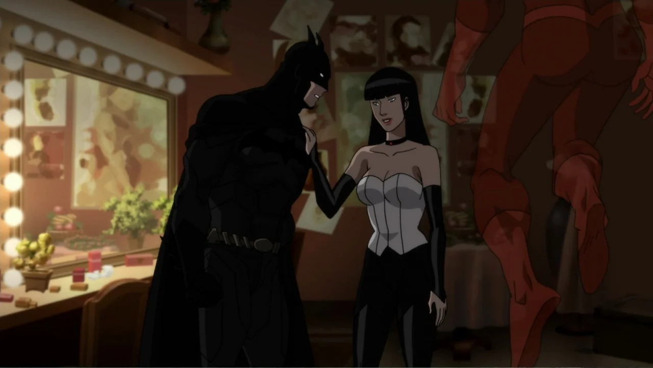 Justice League Dark (2017) movie still: medium — A dimly lit dressing room featuring a vanity table with glowing bulbs and pinned photos. A woman in…