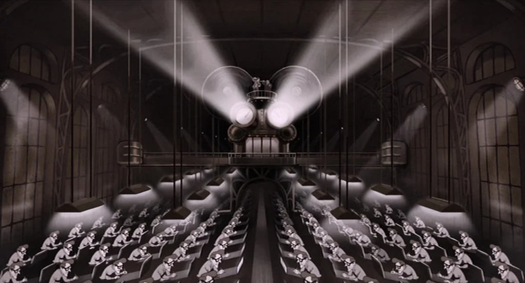 The Congress (2013) movie still: wide — A vast industrial factory floor contains rows of identical workers seated at desk stations. A large central…