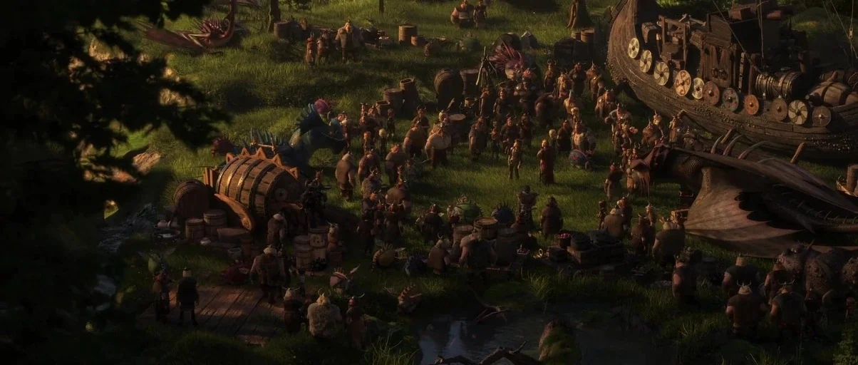 How to Train Your Dragon: The Hidden World (2019) movie still: wide — A grassy clearing serves as a hub for vikings and dragons near a longship.…