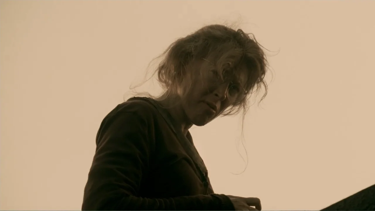 The Texas Chainsaw Massacre: The Beginning (2006) movie still: medium — An outdoor area with a featureless, bright sky backdrop during the day. A…