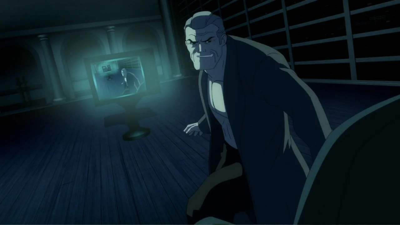 Batman: The Dark Knight Returns, Part 1 (2012) movie still: medium — A dimly lit room at night features a large flat-screen television emitting blue…