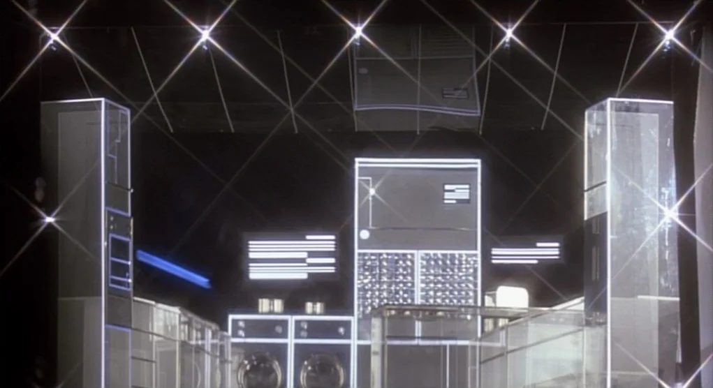 Time Bandits (1981) movie still: establishing — A dark, void-like space features futuristic kitchen appliances outlined with bright white neon…