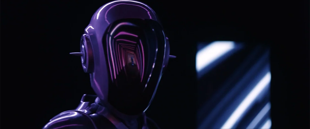 M3GAN 2.0 (2025) movie still: closeup — A dark space contains a single robotic head with a glossy, reflective visor. A tunnel-like light pattern…