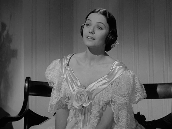 Young Mr. Lincoln (1939) movie still: medium — A well-lit room with vertical striped wallpaper serves as the backdrop for this portrait. A young…
