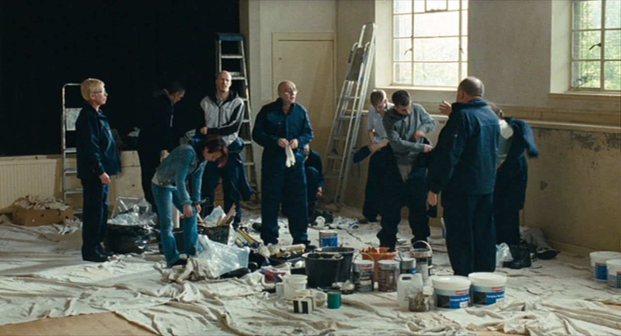 The Angel’s Share (2012) movie still: wide — A spacious room under renovation features drop cloths covering the floor and metal ladders. A diverse…